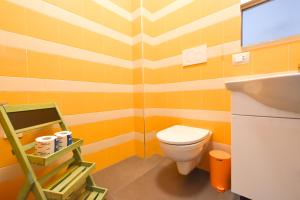 a bathroom with a toilet and a sink at Levante Sea View Apartment - Housea in Polignano a Mare +14 photos