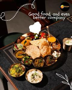 a tray of food on a table with food on it at Mango People Farm in Gurgaon