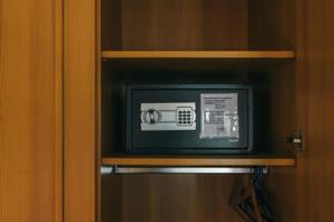 a microwave sitting on a shelf in a cabinet at Rosi's Dorfwirtschaft in Rottenacker