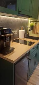 a coffee maker sitting on top of a kitchen counter at Tähetee Majake in Palometsa