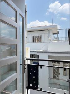 a balcony with a view of a building at Four P Home and Studio in Ho Chi Minh City