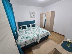 a bedroom with a bed with a blue canopy at Apartment Angel in Kotor