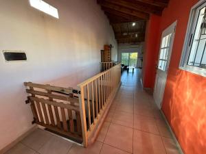 a hallway with a staircase in a house at Departamento Martinez in Martínez