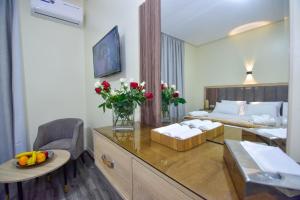 a hotel room with a bedroom with a bed at Hôtel Atlas in Tangier
