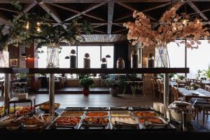 a buffet of food on a table in a restaurant at Amberd Hotel in Byurakan