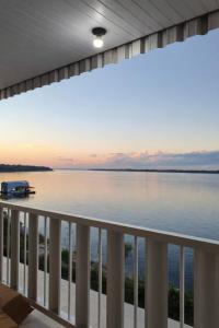 a view of the water from the balcony of a house at Hotel Star Rio in Novo Airão