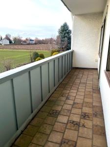 a balcony with a fence and a view of a field at Haus in Kamen Nähe Sportschule in Kamen