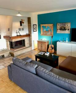 a living room with a couch and a fireplace at Haus in Kamen Nähe Sportschule in Kamen