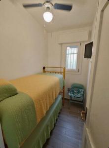 a bedroom with two beds and a window at Piazzetta 293 in Rosolina Mare