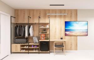 a dressing room with a desk and a tv on a wall at KIBO Boutique in Frumuşani