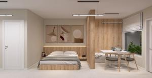a bedroom with a bed and a table at KIBO Boutique in Frumuşani