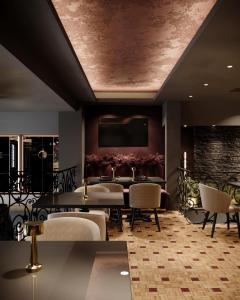 a dining room with a table and chairs at Hotel Bela Kuka - White House in Bitola