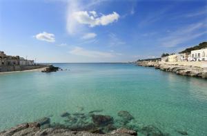 a view of a body of water with buildings at Casa Brumar in Nardò