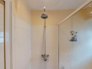 a bathroom with a shower with a shower head at 2 Bed in Aberdyfi oc-dy015 in Aberdyfi +11 photos
