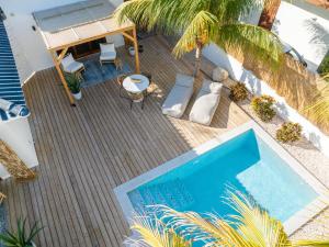 an overhead view of a swimming pool on a deck at Villa CuraSol in Jan Thiel