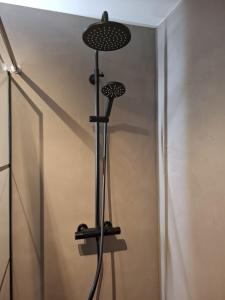 a shower with a black stand with two fans at BonAparte in Hank +22 photos