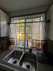 a kitchen sink and a window in a kitchen at Sugarmon Villas in Soufrière +119 photos