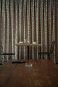 a table and two chairs in front of a curtain at Hera Suit Ataşehir in Istanbul +45 photos