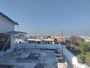 a balcony of a house with a view of a city at Leisure Paradise in Kharar
