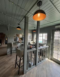 a kitchen and dining room with a table and chairs at Smugglers Hotel in Brixham