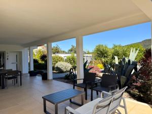 a patio with chairs and a table and some plants at Casa Carvalhal - Adults Only in Góis +55 photos