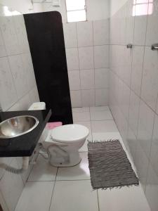 a bathroom with a toilet and a sink at pousada chykos in Barreirinhas +41 photos