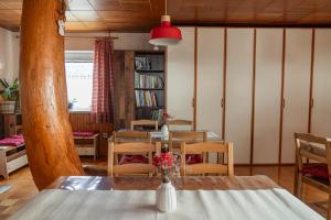 a dining room with a table and chairs at Gorski biser in Mojstrana