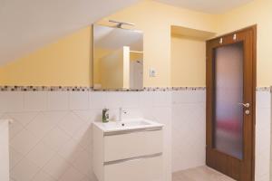 a bathroom with a sink and a mirror at Gorski biser in Mojstrana +71 photos