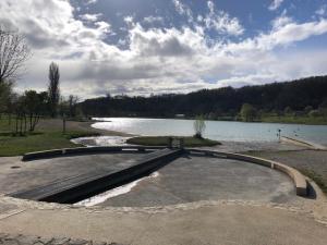a bench next to a body of water at Chez Cathy in Saint-Donat-sur-lʼHerbasse +4 photos