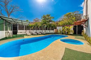 a swimming pool in the backyard of a house at Garza 912 in Carpintero