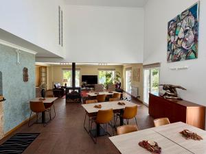 a restaurant with tables and chairs in a room at Casa Carvalhal - Adults Only in Góis
