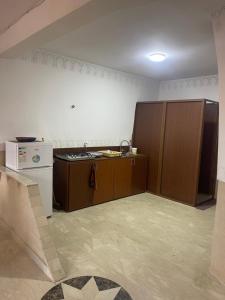 a kitchen with a sink and a refrigerator at Appartement Marrakech in Marrakesh +4 photos