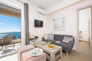 a living room with a couch and a table at Villa Sequoia Yellow in Barbati