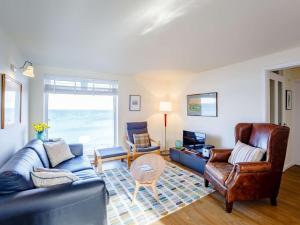 a living room with a couch and a table at 2 Bed in Berwick-upon-tweed oc-82189 in Spittal