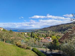 a view of a town from a hill at Vista Garda, Casa Vacanze in Roe