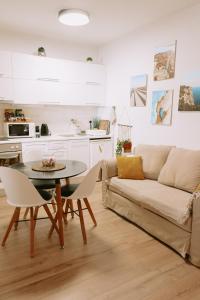 a living room with a couch and a table at Studio Mare in Zadar