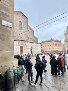 a group of people standing in front of a building at Residenza il Sole in Bologna