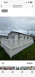a white fence in front of a house at Tayock Park in Montrose