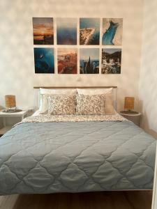 a bedroom with a large bed with two night stands at Studio Mare in Zadar