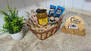 a basket of food and condiments sitting on a counter at apartman Stojković - Banja Ždrelo na 10 min in Petrovac na Mlavi