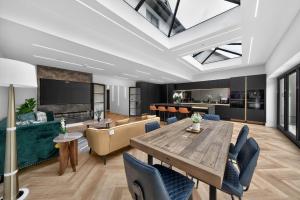a living room with a table and a couch at Ty Hir in Llanelli