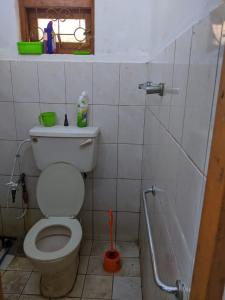 a bathroom with a toilet and a window at dankotuwa in Seeduwa