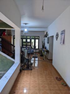a living room with a gym with a treadmill at dankotuwa in Seeduwa
