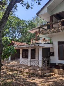 a house with a tree in front of it at dankotuwa in Seeduwa