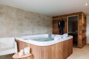 a large bath tub in a bathroom at chalet in authentic Manigod farm in Manigod