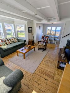 a living room with a couch and a coffee table at Wild Cove Retreat & Nook in Twillingate