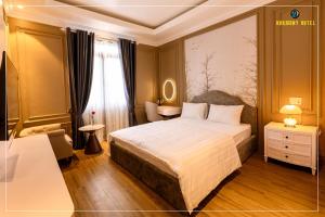 a hotel room with a bed and a window at Harmony Hotel Nam Định in Như Thức