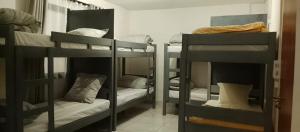 a group of bunk beds in a room at Canaan Hôtel Antsirabe in Antsirabe