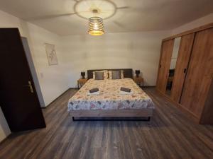 a bedroom with a bed in a room at Jinn's Valley Apartment in Grižane