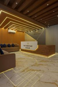 a lobby with a sign that reads the heritage clinic at The Heritage Chinar by Ackee Tree in Srinagar